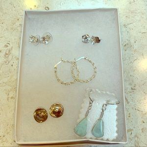 Five pairs of silver earrings